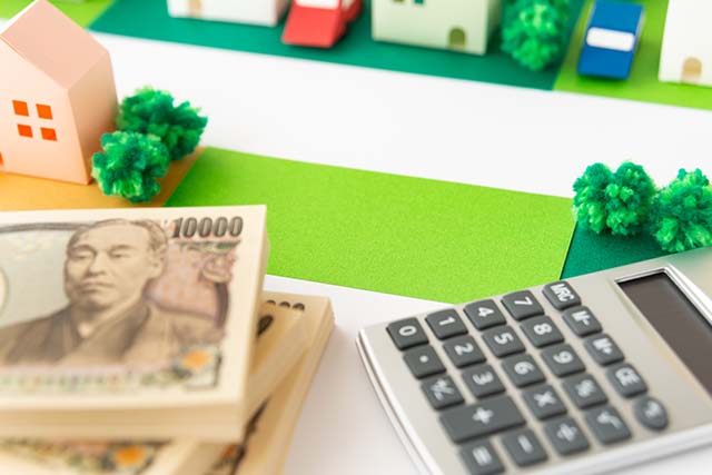 更地の模型と電卓